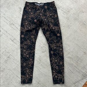 Nike Cream and Black Leggings with Intricate Pattern